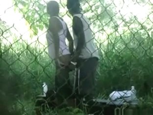 Voyeur tapes a black girl couple having sex on bench in the park