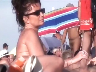 Horny mature nudists at a beach