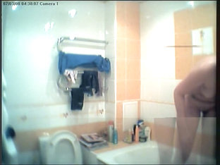 Lewd cameraman spying fem on hidden webcam shower