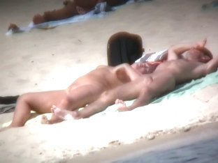 Aluring beach video of nudists enjoying the warm sun