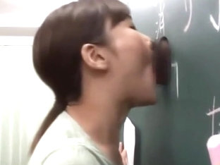 Japanese teacher gives a valuable lesson at the blackboard