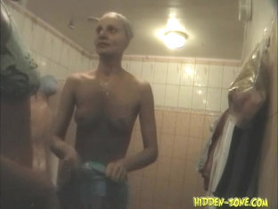 Nude swimmer taking bathe suit on in shower spy vid