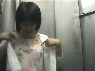 Hidden camera in changing room shows a hot bodied Asian girl.