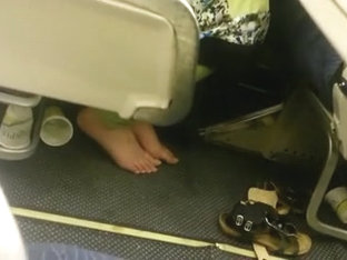 candid feet in plane