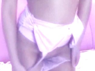 Webcam model showing her big boobs in her pink room
