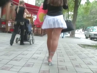 Voyeur Video Of A Woman In High Heels And White Skirt
