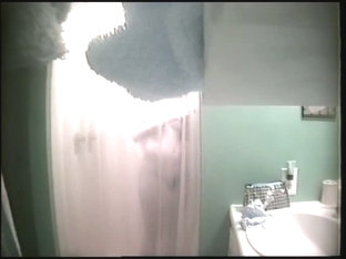 An alluring bimbo caught on a spy cam in the shower