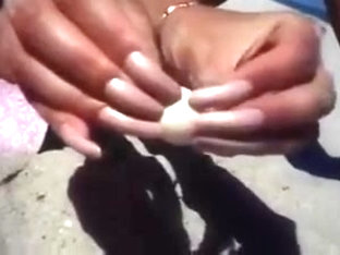Long Nails And Sand On The Beach