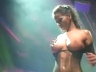 Breasty stripper on the stage teasing and dildoing cunt