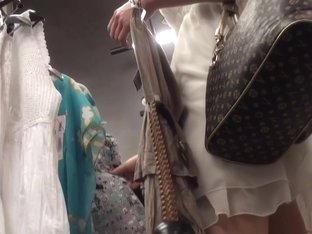 Petite upskirt voyeur chicks in a store