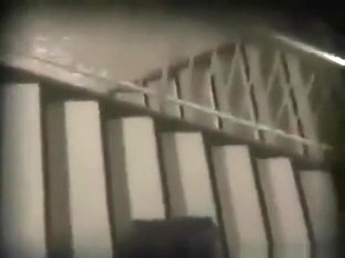 Voyeur tapes an asian girl fucking her bf on the stairs of a building