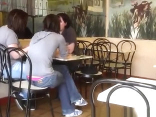 Pink thong exposed at cafe table