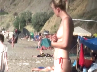 Topless babe voyeured on a beach