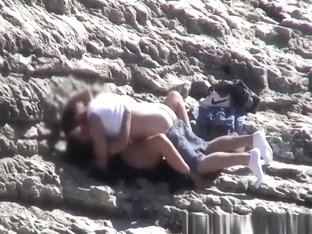 Couple spied fucking in rocky beach