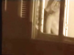 Man kissing the naked lover on window voyeur movie