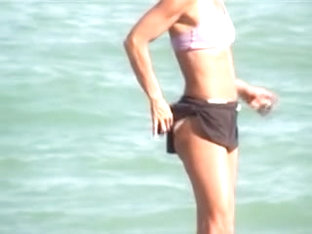 Sporty Girl In Sexy Bra And Candid Shorts On The Beach 01m