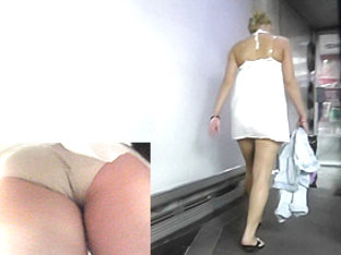 Lady in white dress walks around in upskirt free clip