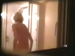 Hidden shower videos feature a sexy, moist blond girl.