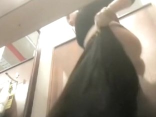 Babe in changing room trying on cloths and getting ass spied