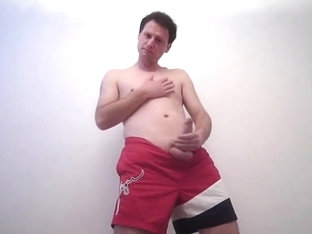 Kudoslong is in red shorts starts playing with his cock and wanking.