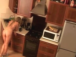 Blonde chick naked in the kitchen