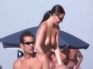 A Couple Masturbates On Nudist Beach