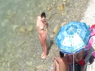 Nude women in rocky beach