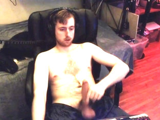 20 something cam model jerks off watching porn while audience watches him