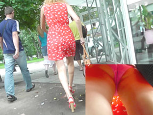 Young babe in cute red dress in the upskirt video