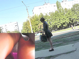 Upskirt free footage presents young girl in dark skirt