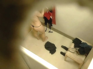 Hidden camera in changing room gets naked brunette