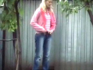 Blonde Girl In Tight Jeans Pants Peeing Outdoors