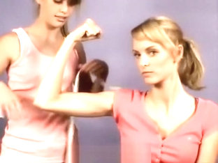 2 Young Girls Comparing Their Muscles