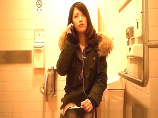 Asian woman spied in toilet peeing