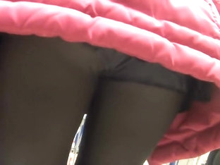 Peeping upskirt under a red jacket