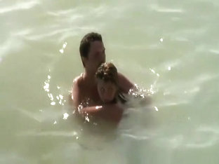 Nudist couple caught fucking in the water