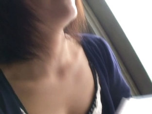 Asian beauty filmed by a horny down blouse voyeur.