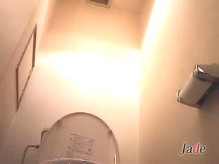 Japanese bimbos taking a piss in the toilet on hidden camera