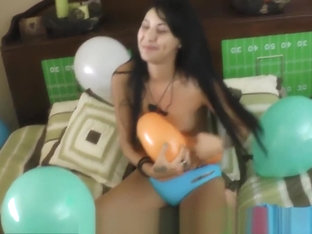 Esmi pops big balloons in her room