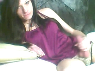 Innocent tgirl wearing a purple top jerks her big hard dick