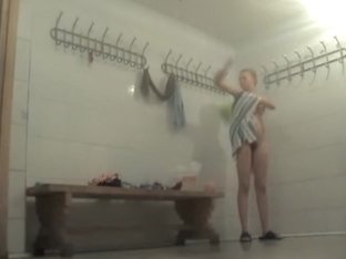 Naked young girl with sexy ass dressed in the locker room