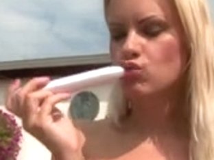 Golden-Haired Playing With a Miniature White Marital-Device