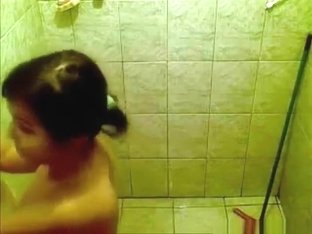 Voyeur Tapes A Ponytailed Brunette Taking A Shower