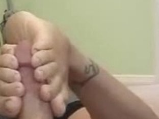 Girl Gives A Footjob And Get Spunk On Her Toes