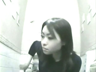 Nice Asian Woman Is Caught On Camera While Pissing In Toilet