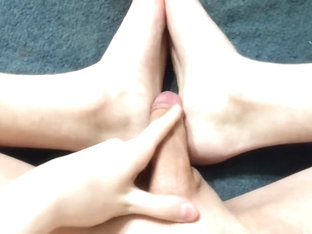 The guy jerks off with his feet and moans