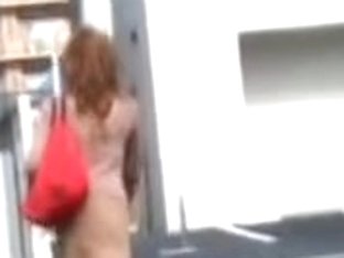 Redhead Babe Got Skirt Sharked And Her Butt Peeped A Bit