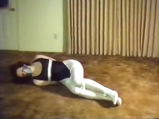 Woman Tied In Black Leotard And White Tights
